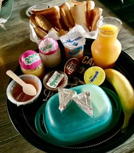 a plate of food with breakfast foods and a drink at Villa Saphir in Sainte-Anne