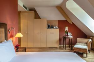 Postel nebo postele na pokoji v ubytování Hôtel Résidence Parc des Eaux Vives