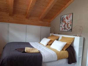 a bedroom with a large bed with two pillows at "NAMASTE" Chambre zen au calme in Saint-Jean-d'Aulps