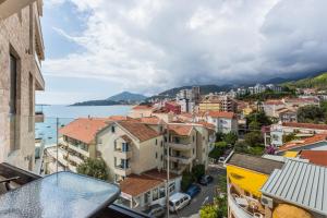 a view of a city from a balcony at Apartments BEATRICE Rafailovici in Rafailovici