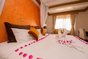 Voodi või voodid majutusasutuse Marble Arch Hotel toas