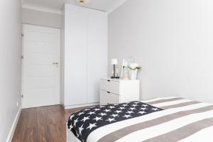 Łóżko lub łóżka w pokoju w obiekcie Apartament Forest - Parking - Praia Apartments Sopot Aquapark