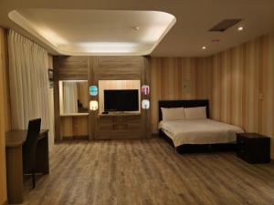 君洋飯店Co-Living Hotel 龍潭科學園區 楊梅幼獅 月租旅居共生宅客房内的一张或多张床位