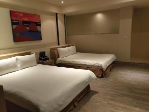 君洋飯店Co-Living Hotel 龍潭科學園區 楊梅幼獅 月租旅居共生宅客房内的一张或多张床位