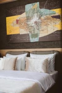 Postel nebo postele na pokoji v ubytování Maccani Black Luxury Suites