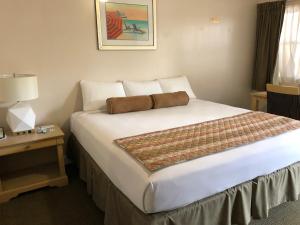 Postel nebo postele na pokoji v ubytování Beach Place Hotel
