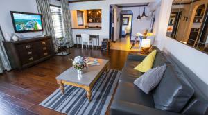 a living room with a couch and a table at Lincoln Arms Suites in Miami Beach