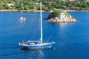 a sailboat in the middle of a large body of water at Golden Tulip Porto-Vecchio in Porto-Vecchio