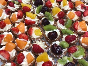 a close up of a dessert with fruit on it at Grand Hotel Il Ninfeo in Gaeta
