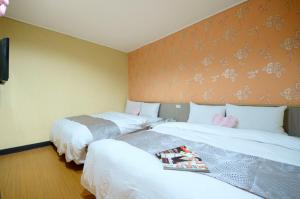 Giường trong phòng chung tại Baoshan Hotel