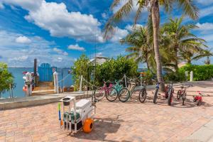 a group of bikes parked next to the water at Heaven Can't Wait in Stuart +44 photos