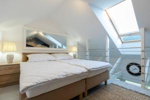 Posteľ alebo postele v izbe v ubytovaní Apartament K2