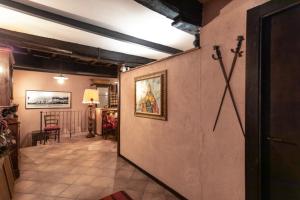 a hallway with a door leading to a living room at Casetta Di Carlo Magno in Sutri