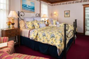 Ένα ή περισσότερα κρεβάτια σε δωμάτιο στο Palmer House Inn