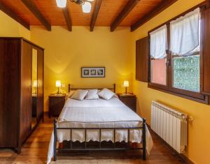 Posteľ alebo postele v izbe v ubytovaní Apartamentos Miradorderodiles Bellavista