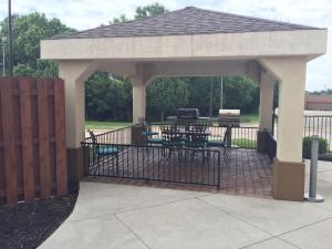a gazebo with a picnic table and a grill at Candlewood Suites Woodward, an IHG Hotel in Woodward