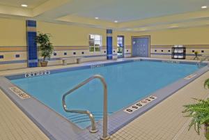 a large swimming pool in a hotel room at Staybridge Suites London, an IHG Hotel in London