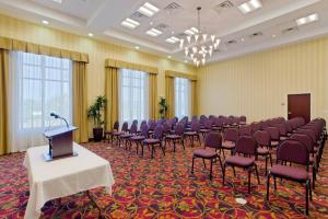 a room with rows of chairs and a podium at Holiday Inn Express Woodstock-Shenandoah Valley, an IHG Hotel in Woodstock