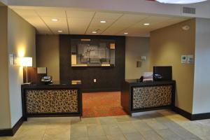 a lobby with two reception desks in a hotel at Holiday Inn Express Salem, an IHG Hotel in Salem