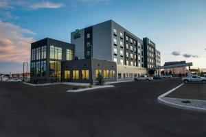 a parking lot in front of a large building at Holiday Inn Express - Lethbridge Southeast, an IHG Hotel in Lethbridge