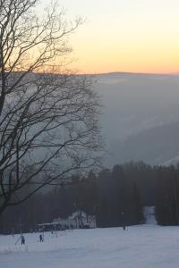 Horská chata Hubertus v zimě + 6 fotografií