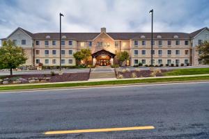 a large building on the side of a road at Staybridge Suites Madison - East, an IHG Hotel in Madison