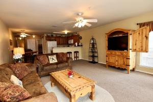 a living room with a couch and a coffee table at River Run Waterwheel in New Braunfels