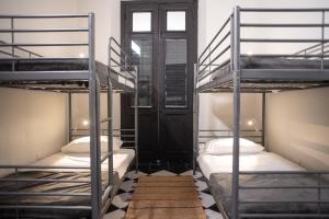 Letto o letti in una camera di Fortel Hostel