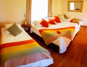 Postel nebo postele na pokoji v ubytování Pikera Uri Eco Lodge