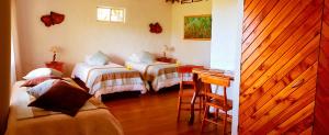 Postel nebo postele na pokoji v ubytování Pikera Uri Eco Lodge