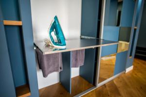 a glass shelf with a pair of shoes on it at Old Town - EuroEastVentures Luxury Properties in Bucharest