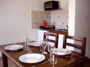 Una cocina o kitchenette en Ayuntunhue Apart Hotel