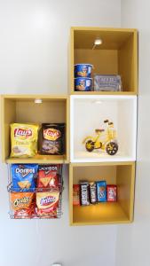 a shelf filled with food and a toy motorcycle on it at Landsford Inn in Fort Lawn