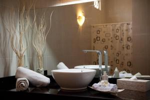 a bathroom with a bowl sink on a counter at Blue Marine Resort in Gili Air