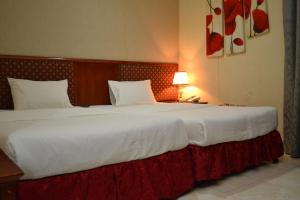 Posteľ alebo postele v izbe v ubytovaní Al Zain Hotel