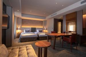 Tempat tidur dalam kamar di Tokyu Stay Kyoto Sakaiza Shijo Kawaramachi