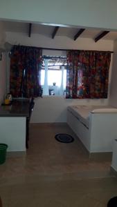 Kuchyň nebo kuchyňský kout v ubytování Anicia Beach House