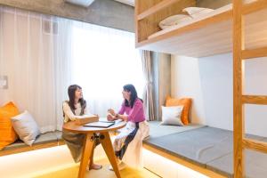 Postel nebo postele na pokoji v ubytování Sakura Cross Hotel Tokyo Kayabacho