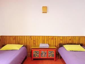 Voodi või voodid majutusasutuse Swayambhu View Guest House toas