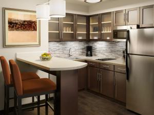 a kitchen with a refrigerator, stove, sink and dishwasher at Staybridge Suites - Pittsburgh-Cranberry Township, an IHG Hotel in Warrendale