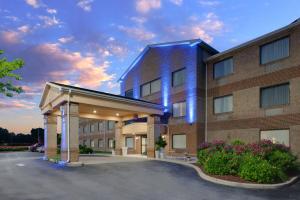 a large brick building with a parking lot at Holiday Inn Express Pocomoke City, an IHG Hotel in Pocomoke City