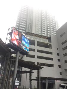 a large building with a billboard in front of it at Avanie Suite at Genting Highland in Genting Highlands