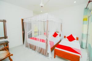 Llit o llits en una habitació de Onaro Beach View
