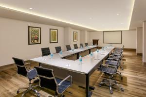 a large conference room with a long table and chairs at Ginger Pune Wakad in Pune