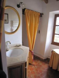 a bathroom with a sink and a mirror at La Frandomière in Saint-Martin-de-Londres +31 photos