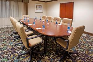 a conference room with a table and chairs with bottles of water at Staybridge Suites Akron-Stow-Cuyahoga Falls by IHG in Stow +33 photos