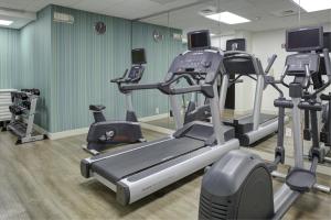 a gym with several tread machines in a room at Holiday Inn Express - Chester, an IHG Hotel in Chester
