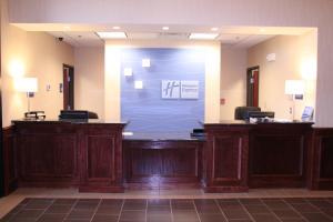 a lobby with a large screen in the middle of a room at Holiday Inn Express Pratt, an IHG Hotel in Pratt