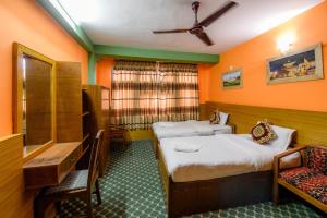 Postel nebo postele na pokoji v ubytování Hotel Pomelo House Inn