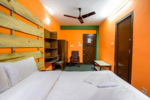 Postel nebo postele na pokoji v ubytování Hotel Pomelo House Inn